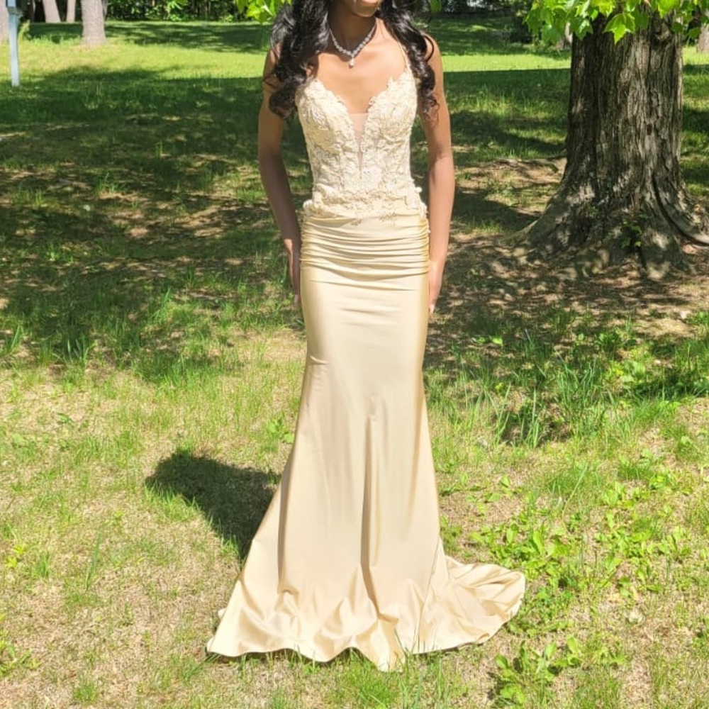 Light beige/ light gold prom dress mermaid style with open back.